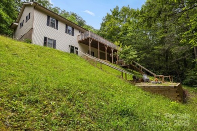 This beautifully updated, turn-key furnished home is nestled on Rumbling Bald Resort on Lake Lure in North Carolina - for sale on GolfHomes.com, golf home, golf lot