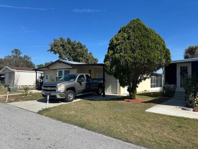 COME LOOK AT THIS UPDATED 2-BEDROOM, 1.5-BATHROOM HOME IN on Anglers Green Golf Course in Florida - for sale on GolfHomes.com, golf home, golf lot