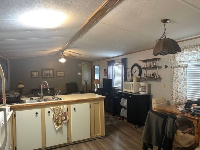 COME LOOK AT THIS UPDATED 2-BEDROOM, 1.5-BATHROOM HOME IN on Anglers Green Golf Course in Florida - for sale on GolfHomes.com, golf home, golf lot