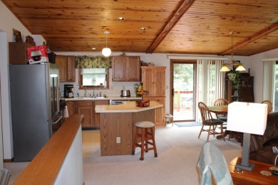 Welcome to this 3 bedroom, 3 bath live edge cedar sided home on Lake Carroll Golf Course in Illinois - for sale on GolfHomes.com, golf home, golf lot