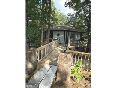 Feels like a treehouse. Perfect starter or vacation rental on Sky Valley Resort and Country Club in Georgia - for sale on GolfHomes.com, golf home, golf lot