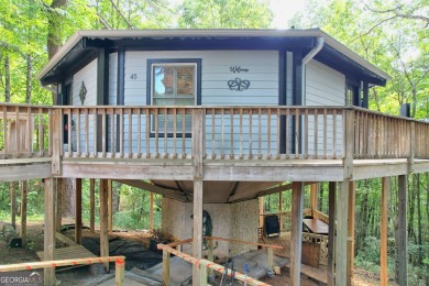 Feels like a treehouse. Perfect starter or vacation rental on Sky Valley Resort and Country Club in Georgia - for sale on GolfHomes.com, golf home, golf lot