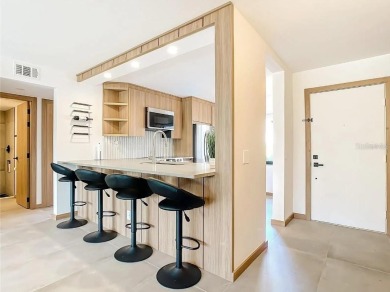 Exquisite FULLY FURNISHED 2-Bed/2-Bath 1st floor Condo Just on Isla Del Sol Yacht and Country Club in Florida - for sale on GolfHomes.com, golf home, golf lot