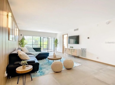Exquisite FULLY FURNISHED 2-Bed/2-Bath 1st floor Condo Just on Isla Del Sol Yacht and Country Club in Florida - for sale on GolfHomes.com, golf home, golf lot