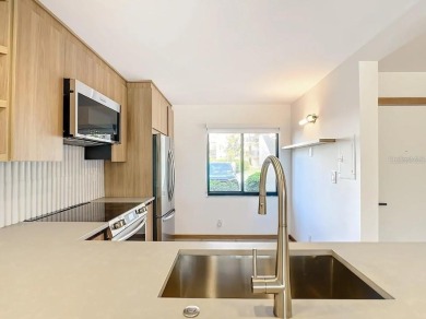 Exquisite FULLY FURNISHED 2-Bed/2-Bath 1st floor Condo Just on Isla Del Sol Yacht and Country Club in Florida - for sale on GolfHomes.com, golf home, golf lot
