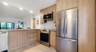 Exquisite FULLY FURNISHED 2-Bed/2-Bath 1st floor Condo Just on Isla Del Sol Yacht and Country Club in Florida - for sale on GolfHomes.com, golf home, golf lot