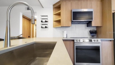 Exquisite FULLY FURNISHED 2-Bed/2-Bath 1st floor Condo Just on Isla Del Sol Yacht and Country Club in Florida - for sale on GolfHomes.com, golf home, golf lot