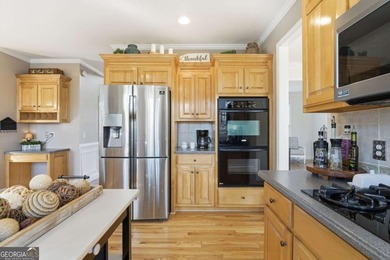 Beautifully maintained home in the BridgeMill community of on Bridgemill Golf Club in Georgia - for sale on GolfHomes.com, golf home, golf lot