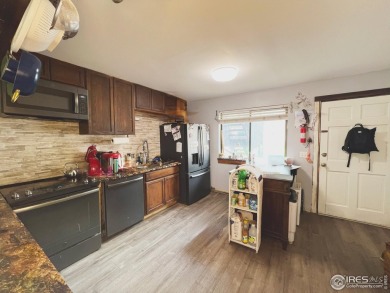 Mountain Views & Modern Comfort 950 Big Thompson Ave. Unit #2142 on Lake Estes Golf Course in Colorado - for sale on GolfHomes.com, golf home, golf lot