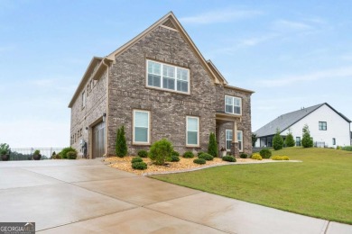 Located in Lakeview-Heron Bay's only gated section-this elegant on Canongate At Heron Bay in Georgia - for sale on GolfHomes.com, golf home, golf lot