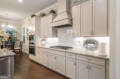 Located in Lakeview-Heron Bay's only gated section-this elegant on Canongate At Heron Bay in Georgia - for sale on GolfHomes.com, golf home, golf lot