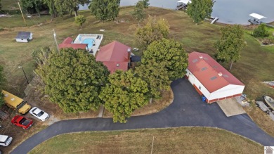 This private *WATERFRONT OASIS OVERLOOKING LAKE BARKLEY* awaits on Boots Randolph Golf Course in Kentucky - for sale on GolfHomes.com, golf home, golf lot