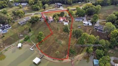 This private *WATERFRONT OASIS OVERLOOKING LAKE BARKLEY* awaits on Boots Randolph Golf Course in Kentucky - for sale on GolfHomes.com, golf home, golf lot