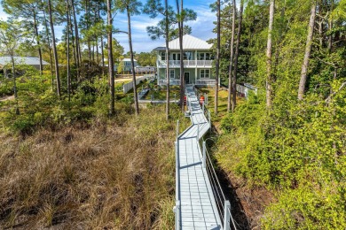 Welcome to your dream coastal retreat, nestled on the serene on Sandestin Golf and Beach Resort - Raven in Florida - for sale on GolfHomes.com, golf home, golf lot