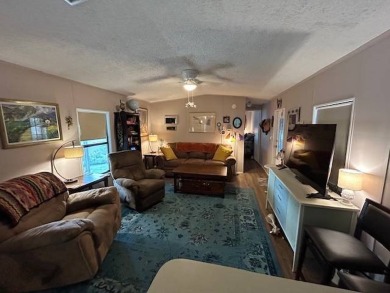 Discover this lovely furnished 2-bedroom, 2-bathroom single-wide on Crystal Lake Club in Florida - for sale on GolfHomes.com, golf home, golf lot