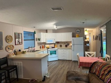 Discover this lovely furnished 2-bedroom, 2-bathroom single-wide on Crystal Lake Club in Florida - for sale on GolfHomes.com, golf home, golf lot