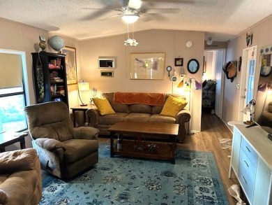 Discover this lovely furnished 2-bedroom, 2-bathroom single-wide on Crystal Lake Club in Florida - for sale on GolfHomes.com, golf home, golf lot