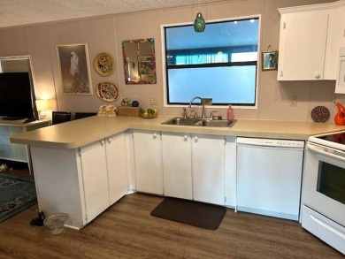 Discover this lovely furnished 2-bedroom, 2-bathroom single-wide on Crystal Lake Club in Florida - for sale on GolfHomes.com, golf home, golf lot