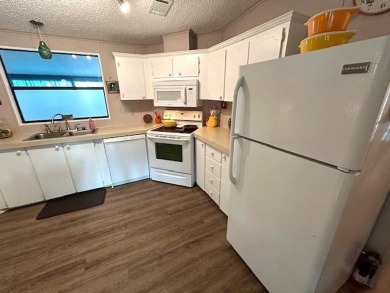 Discover this lovely furnished 2-bedroom, 2-bathroom single-wide on Crystal Lake Club in Florida - for sale on GolfHomes.com, golf home, golf lot