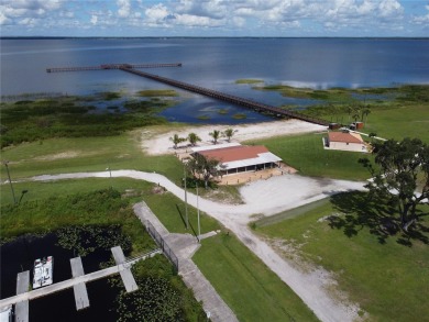 Lakefront and golf course living at its finest! This unique on Indian Lake Estates Golf and Country Club in Florida - for sale on GolfHomes.com, golf home, golf lot
