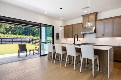 Welcome home to this executive home built by the Toll Brothers on Capital City Club Crabapple in Georgia - for sale on GolfHomes.com, golf home, golf lot