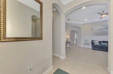 Prepare to be impressed by this meticulously maintained on Sarasota National Golf Club in Florida - for sale on GolfHomes.com, golf home, golf lot