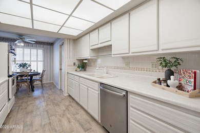 Enter through a charming iron-gated private courtyard that sets on Pebblebrook Golf Course in Arizona - for sale on GolfHomes.com, golf home, golf lot