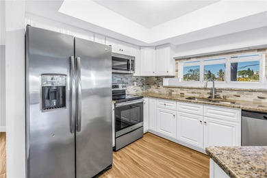 You don't want to miss this beautiful three-story townhouse on Pasadena Yacht and Country Club in Florida - for sale on GolfHomes.com, golf home, golf lot