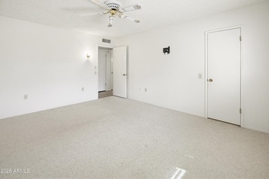 Enter through a charming iron-gated private courtyard that sets on Pebblebrook Golf Course in Arizona - for sale on GolfHomes.com, golf home, golf lot