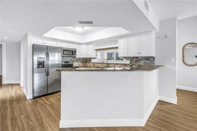 You don't want to miss this beautiful three-story townhouse on Pasadena Yacht and Country Club in Florida - for sale on GolfHomes.com, golf home, golf lot