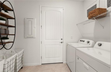 This stunning Hallmark Home Plan offers three spacious bedrooms on Valencia Golf and Country Club in Florida - for sale on GolfHomes.com, golf home, golf lot