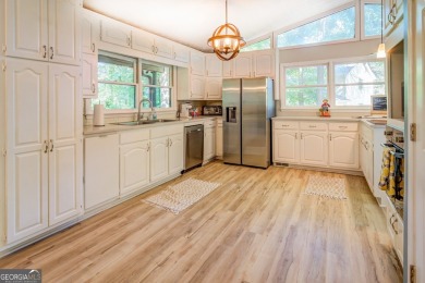 Completely renovated waterfront ranch home with a fully finished on Turtle Cove Golf Course in Georgia - for sale on GolfHomes.com, golf home, golf lot