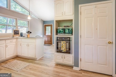 Completely renovated waterfront ranch home with a fully finished on Turtle Cove Golf Course in Georgia - for sale on GolfHomes.com, golf home, golf lot