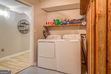 Completely renovated waterfront ranch home with a fully finished on Turtle Cove Golf Course in Georgia - for sale on GolfHomes.com, golf home, golf lot