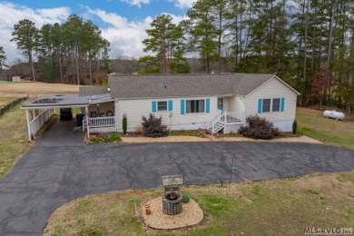 Discover this charming off water Lake Gaston home nestled along on Tanglewood Shores Golf and Country Club in Virginia - for sale on GolfHomes.com, golf home, golf lot
