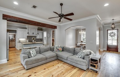 Welcome to this beautifully designed 4-bedroom, 2.5-bath home on Lake Caroline Golf Club in Mississippi - for sale on GolfHomes.com, golf home, golf lot