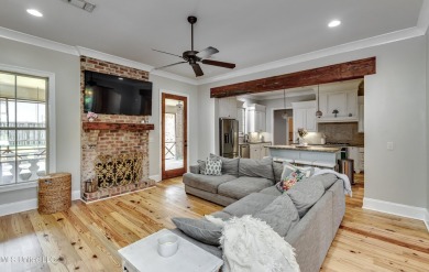 Welcome to this beautifully designed 4-bedroom, 2.5-bath home on Lake Caroline Golf Club in Mississippi - for sale on GolfHomes.com, golf home, golf lot