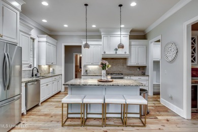 Welcome to this beautifully designed 4-bedroom, 2.5-bath home on Lake Caroline Golf Club in Mississippi - for sale on GolfHomes.com, golf home, golf lot