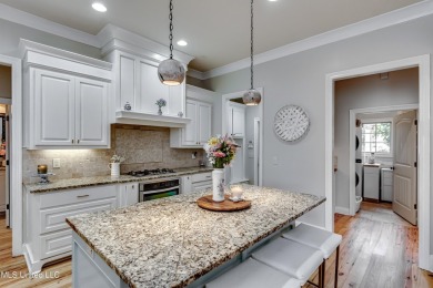 Welcome to this beautifully designed 4-bedroom, 2.5-bath home on Lake Caroline Golf Club in Mississippi - for sale on GolfHomes.com, golf home, golf lot