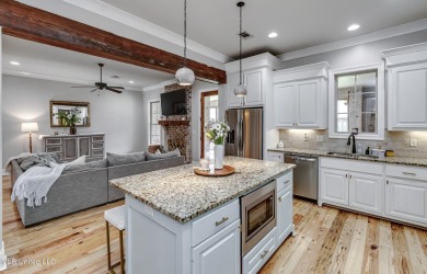 Welcome to this beautifully designed 4-bedroom, 2.5-bath home on Lake Caroline Golf Club in Mississippi - for sale on GolfHomes.com, golf home, golf lot