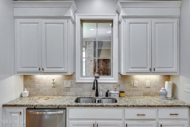 Welcome to this beautifully designed 4-bedroom, 2.5-bath home on Lake Caroline Golf Club in Mississippi - for sale on GolfHomes.com, golf home, golf lot