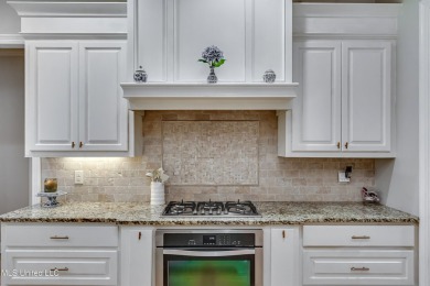 Welcome to this beautifully designed 4-bedroom, 2.5-bath home on Lake Caroline Golf Club in Mississippi - for sale on GolfHomes.com, golf home, golf lot