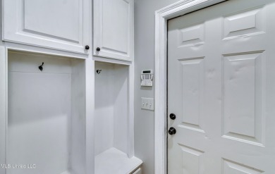 Welcome to this beautifully designed 4-bedroom, 2.5-bath home on Lake Caroline Golf Club in Mississippi - for sale on GolfHomes.com, golf home, golf lot