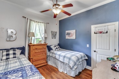 Welcome to this beautifully designed 4-bedroom, 2.5-bath home on Lake Caroline Golf Club in Mississippi - for sale on GolfHomes.com, golf home, golf lot