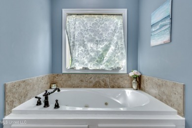 Welcome to this beautifully designed 4-bedroom, 2.5-bath home on Lake Caroline Golf Club in Mississippi - for sale on GolfHomes.com, golf home, golf lot