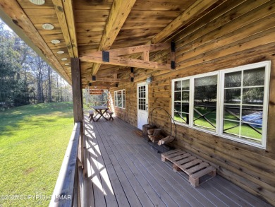 Immaculate Log Cabin in Pocono Farms Country Club Association - on Pocono Farms Country Club in Pennsylvania - for sale on GolfHomes.com, golf home, golf lot