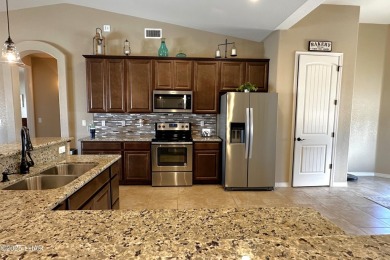 A Stunning RV Garage Pool Home in Lake Havasu City. Nestled on a on London Bridge Golf Course in Arizona - for sale on GolfHomes.com, golf home, golf lot