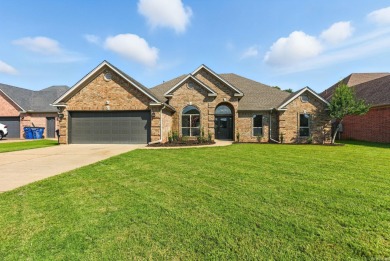 This traditional home located on a quiet street in the Country on The Country Club of Arkansas in Arkansas - for sale on GolfHomes.com, golf home, golf lot