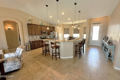A Stunning RV Garage Pool Home in Lake Havasu City. Nestled on a on London Bridge Golf Course in Arizona - for sale on GolfHomes.com, golf home, golf lot