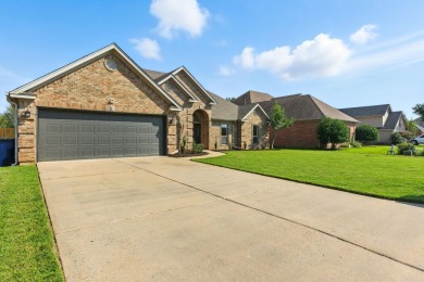 This traditional home located on a quiet street in the Country on The Country Club of Arkansas in Arkansas - for sale on GolfHomes.com, golf home, golf lot